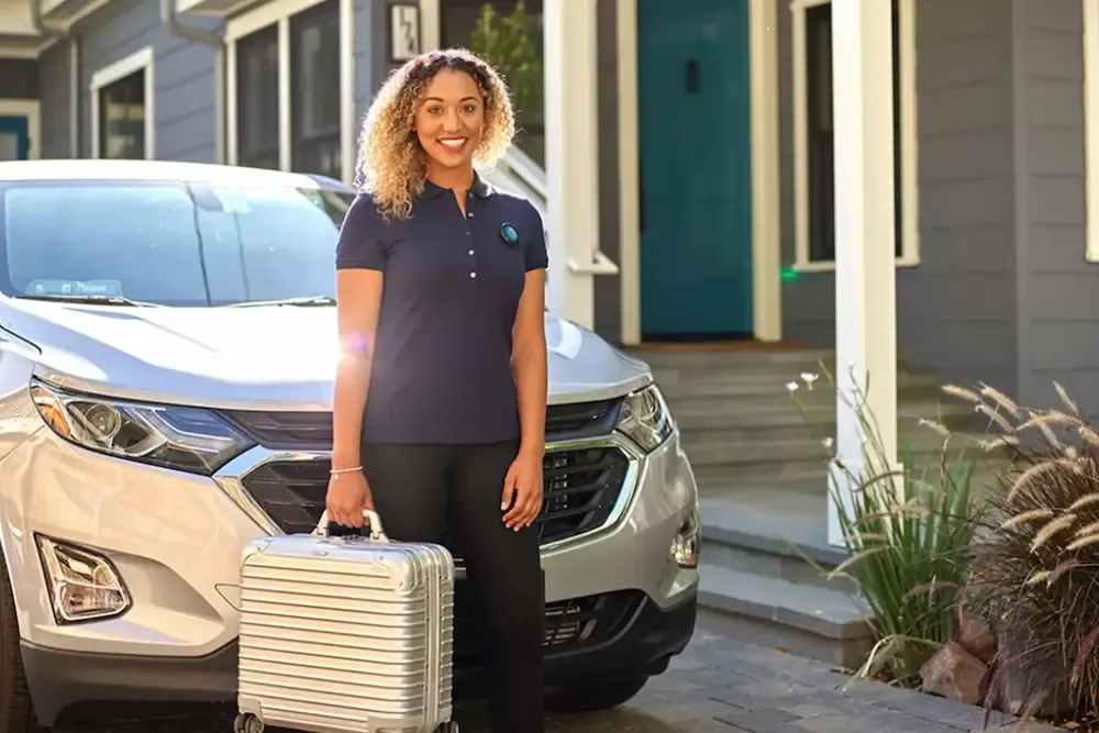 AT&T Ready to Go promotional image of a woman standing in front of a car.